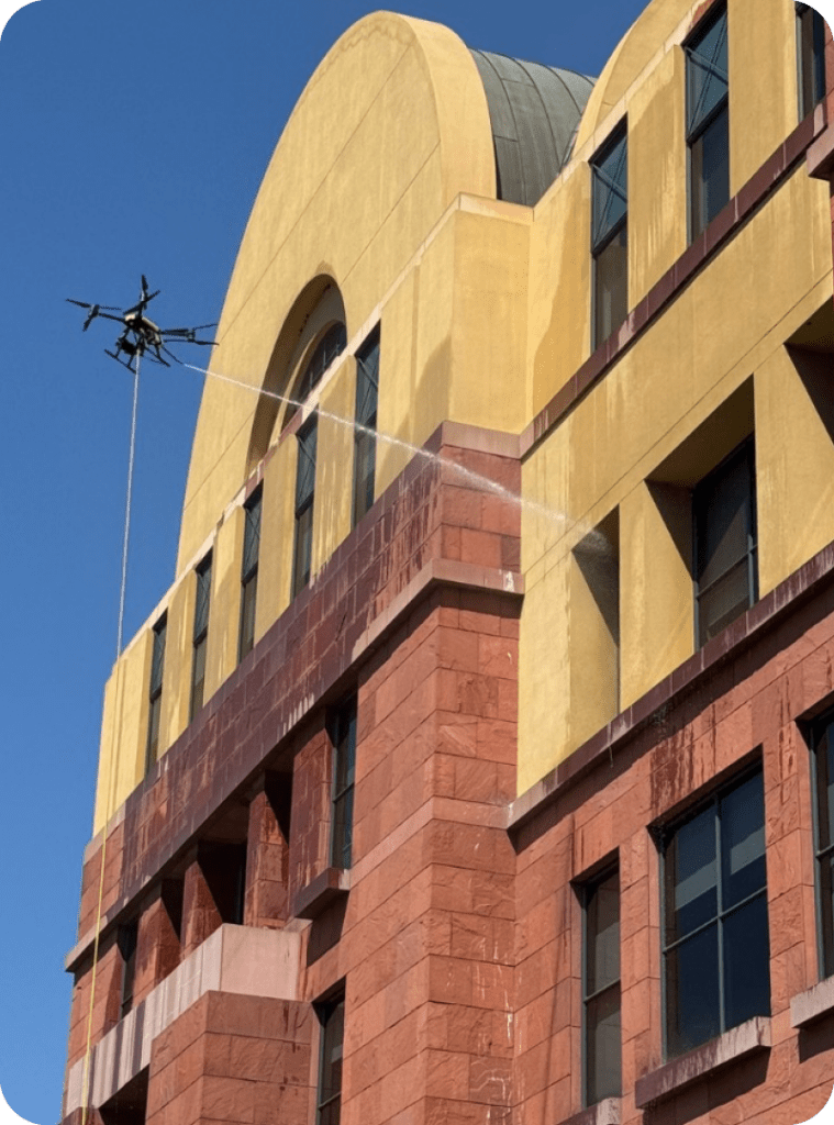 drone washing a building