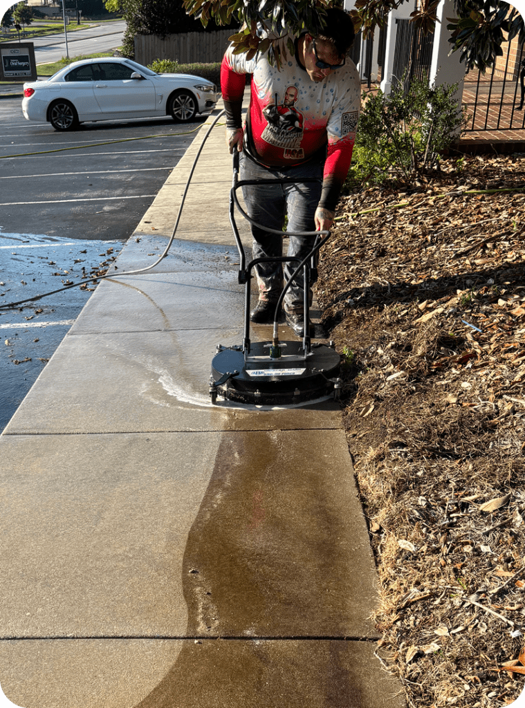 man pressure washing